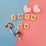 Bright 'Join Us' call-to-action with colorful lollipops and hearts on a pastel background.